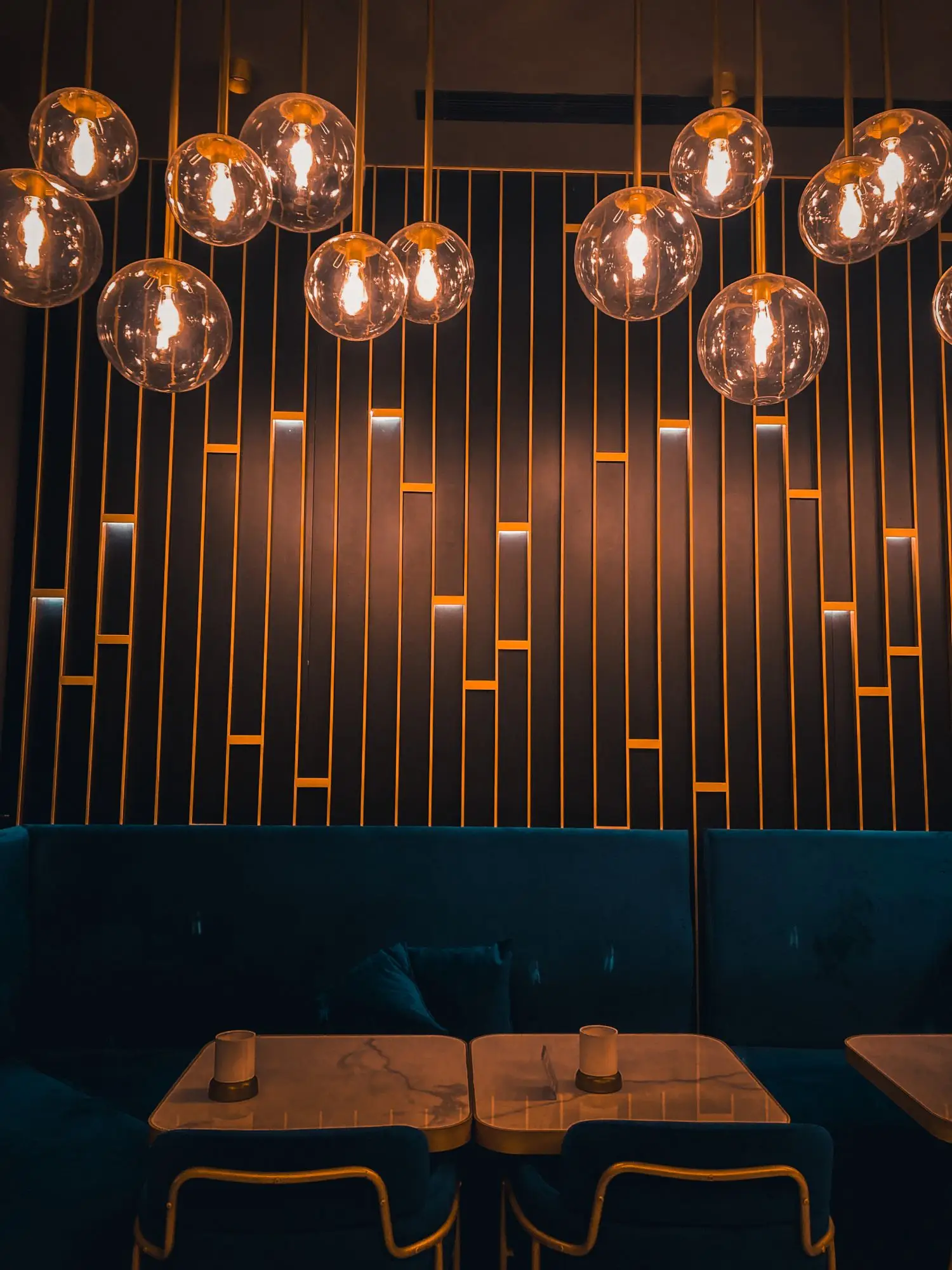 Warm pendant lighting above an intimate restaurant interior