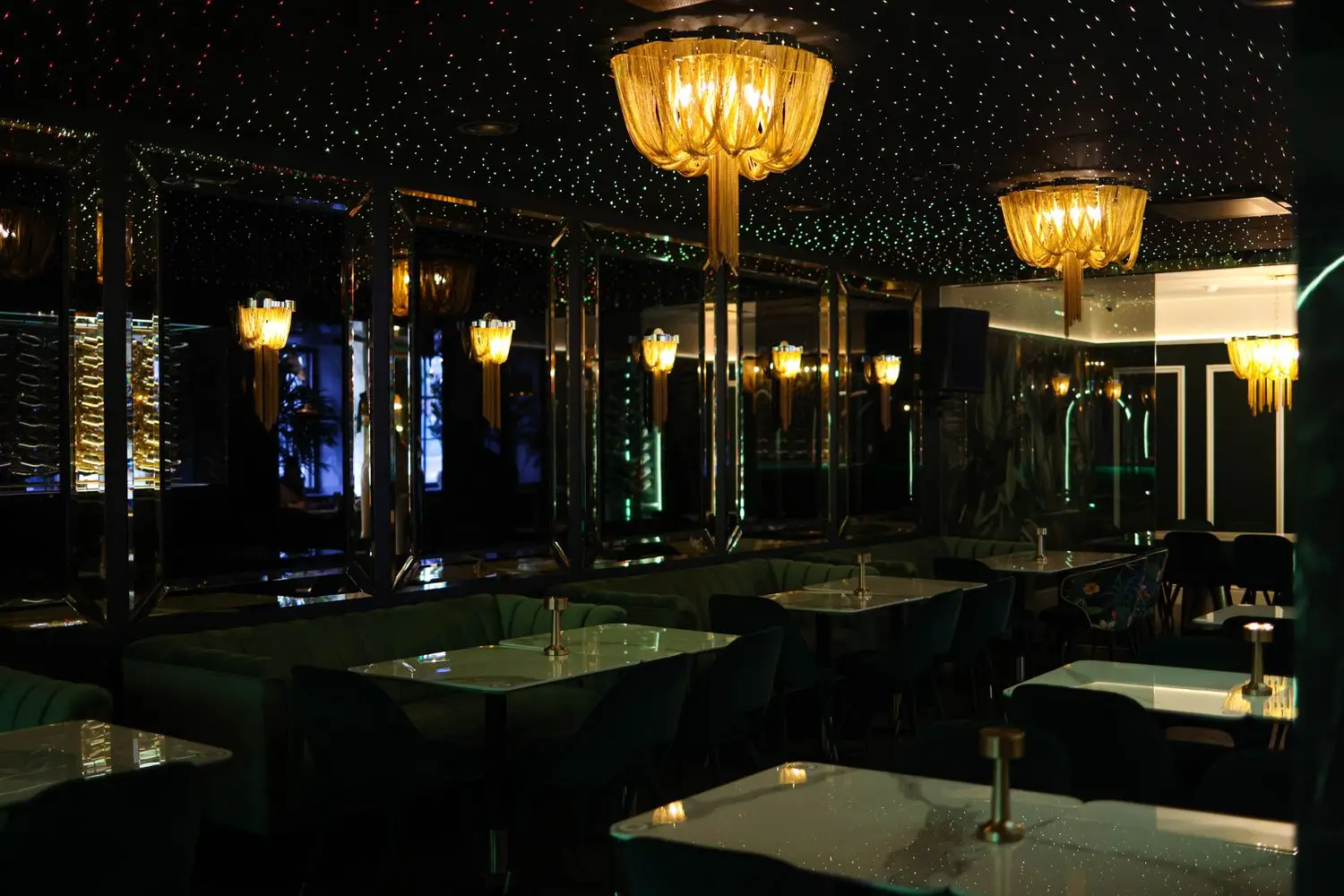 Dark lounge room with warm table lamps