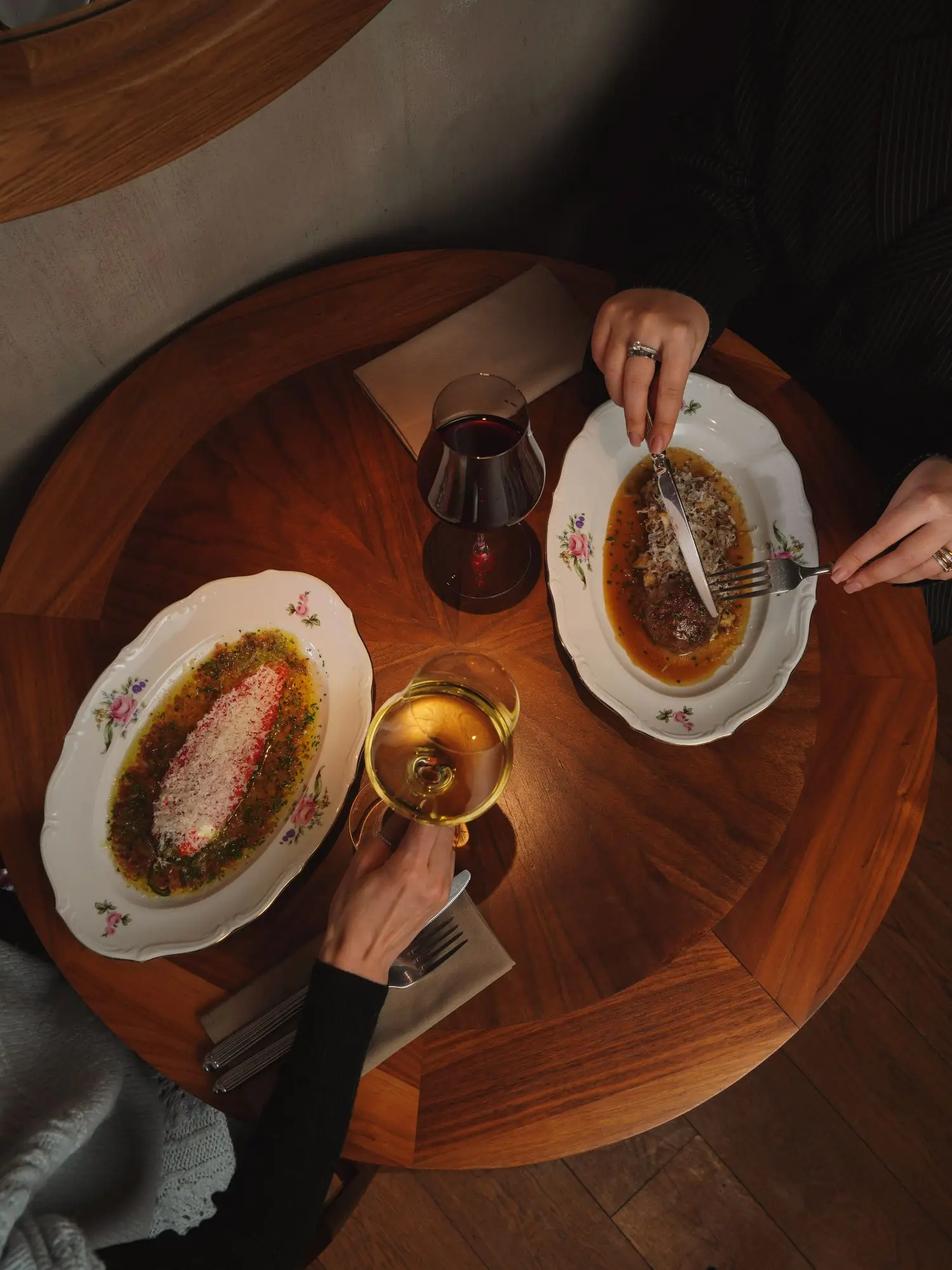 Chef-presented dish on a polished dining table