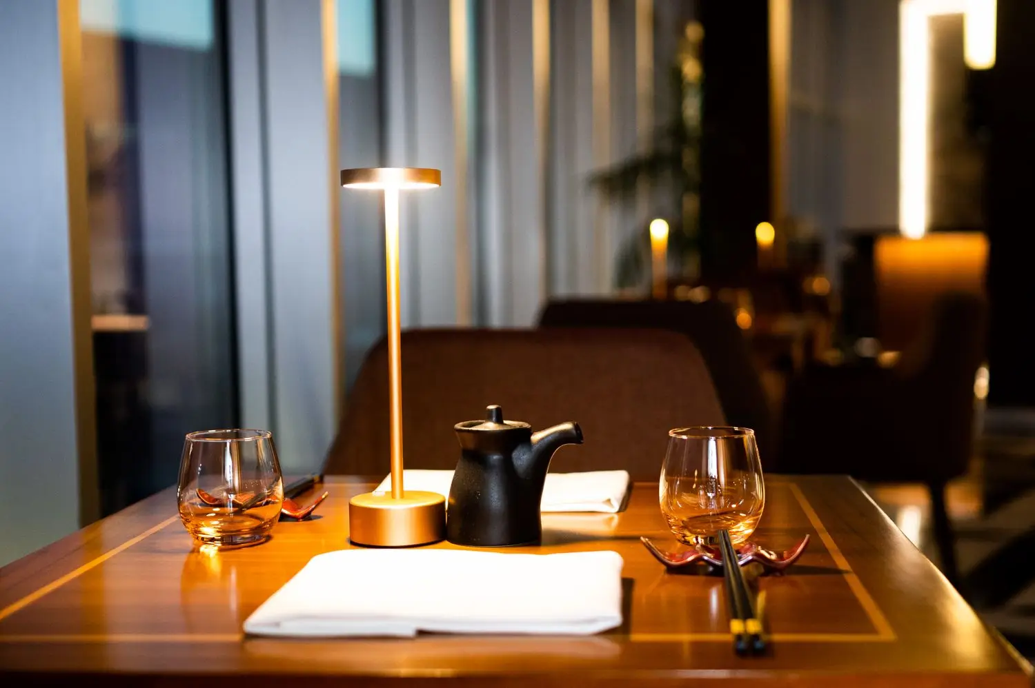 Set restaurant table with warm ambient lighting