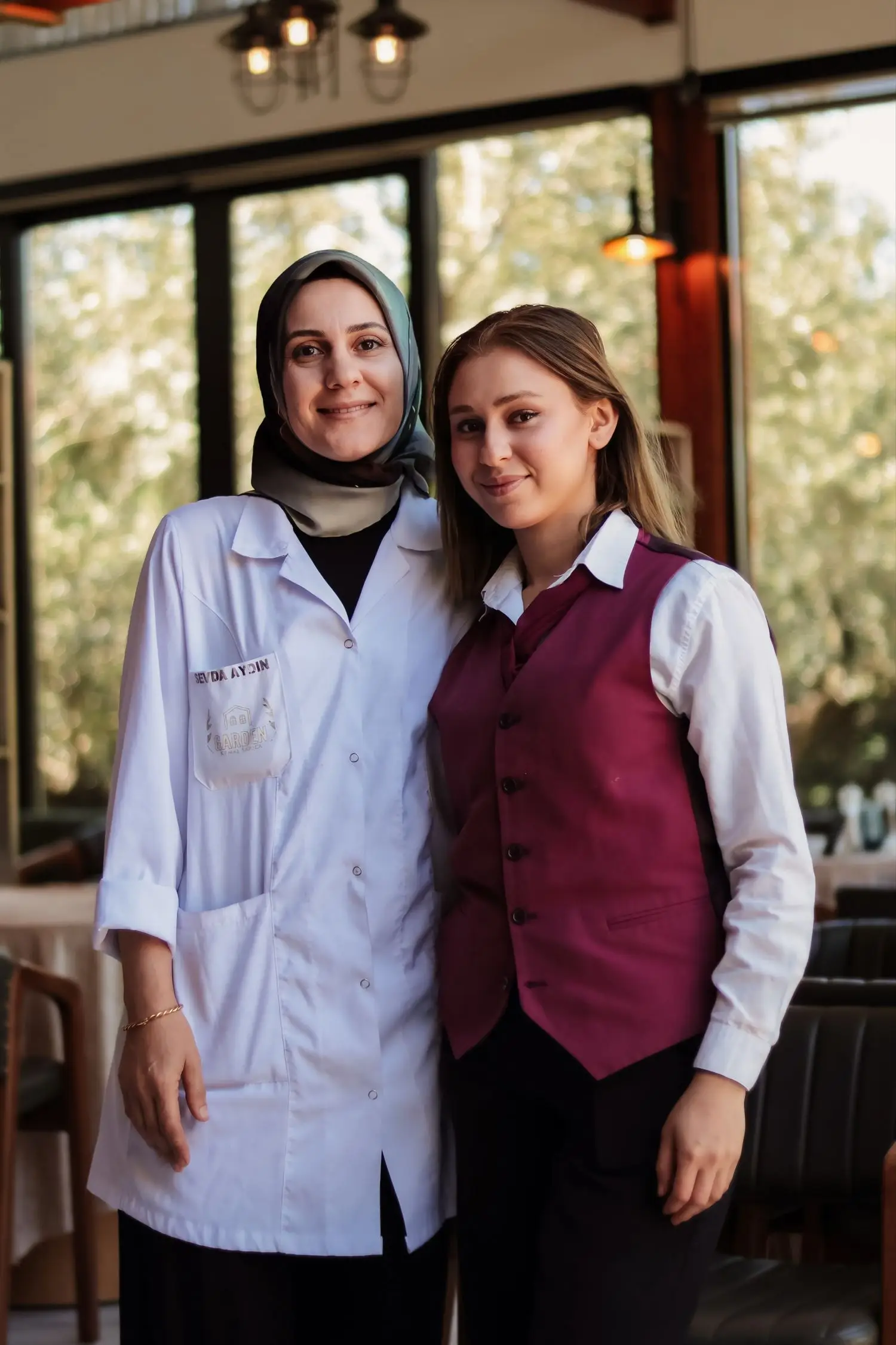 Hospitality team members standing in a restaurant