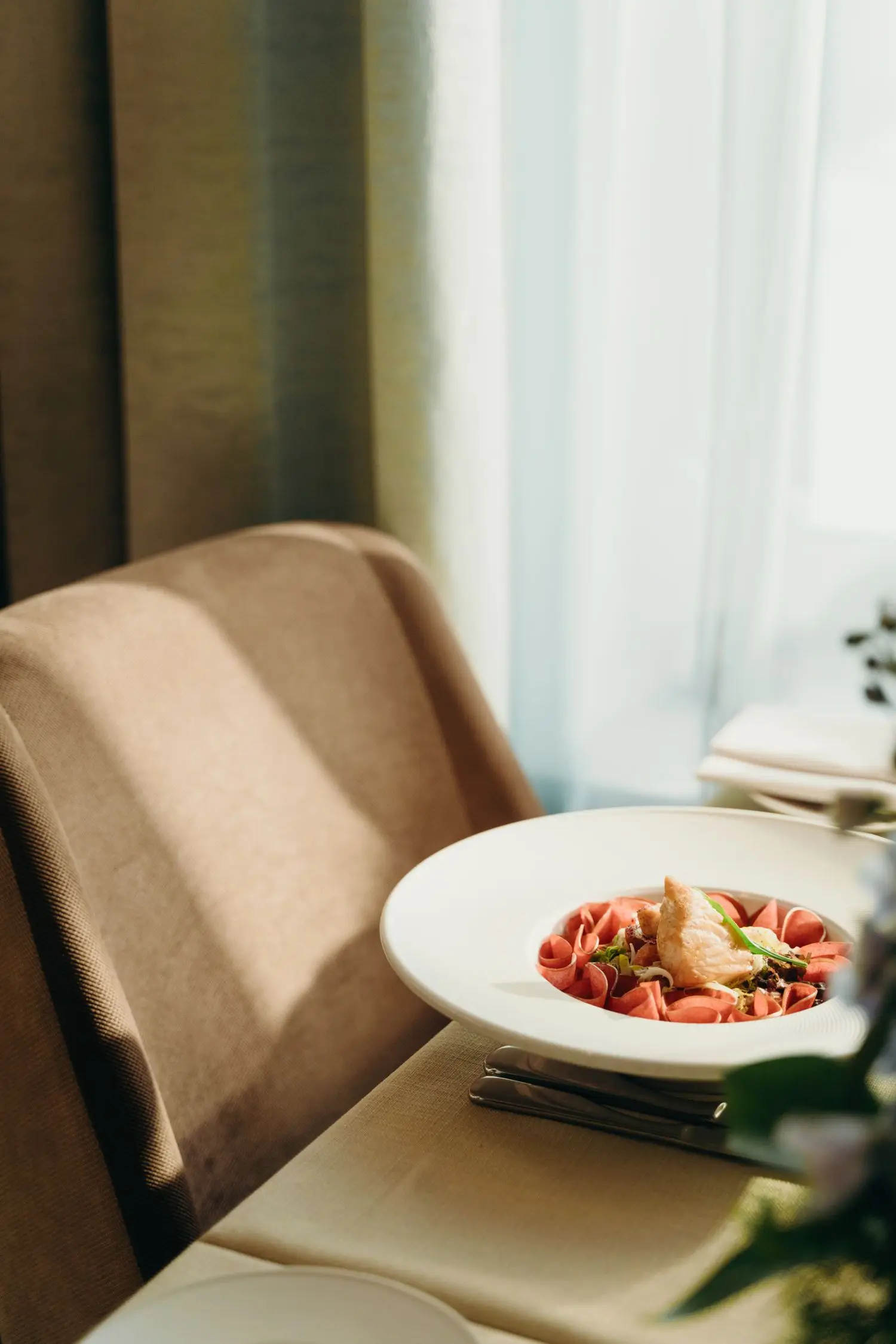 Plated dish beside upholstered seating