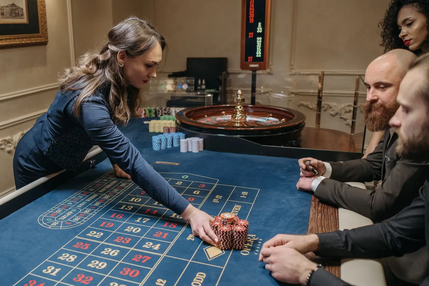Dealer and guests at a casino table
