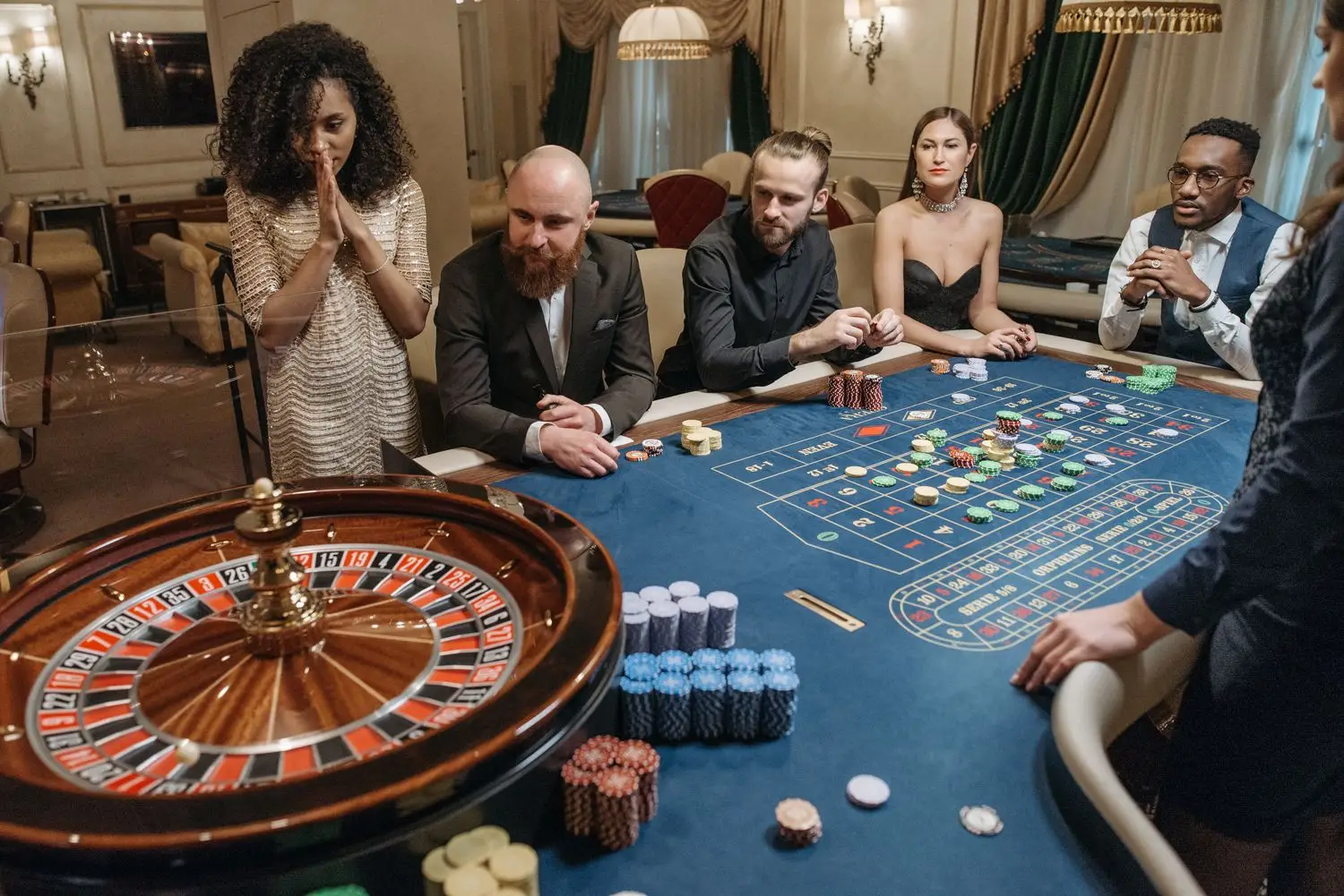 Guests watching a roulette table