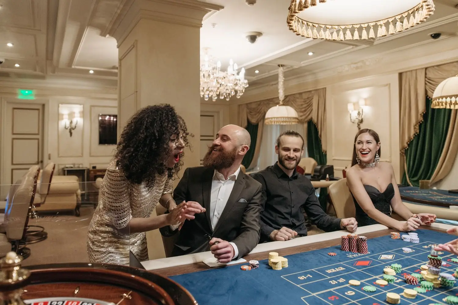 Guests gathered at a casino table in an elegant room